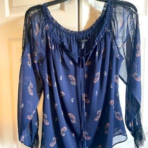 Whbm beautiful navy blouse with lace details on the arms.